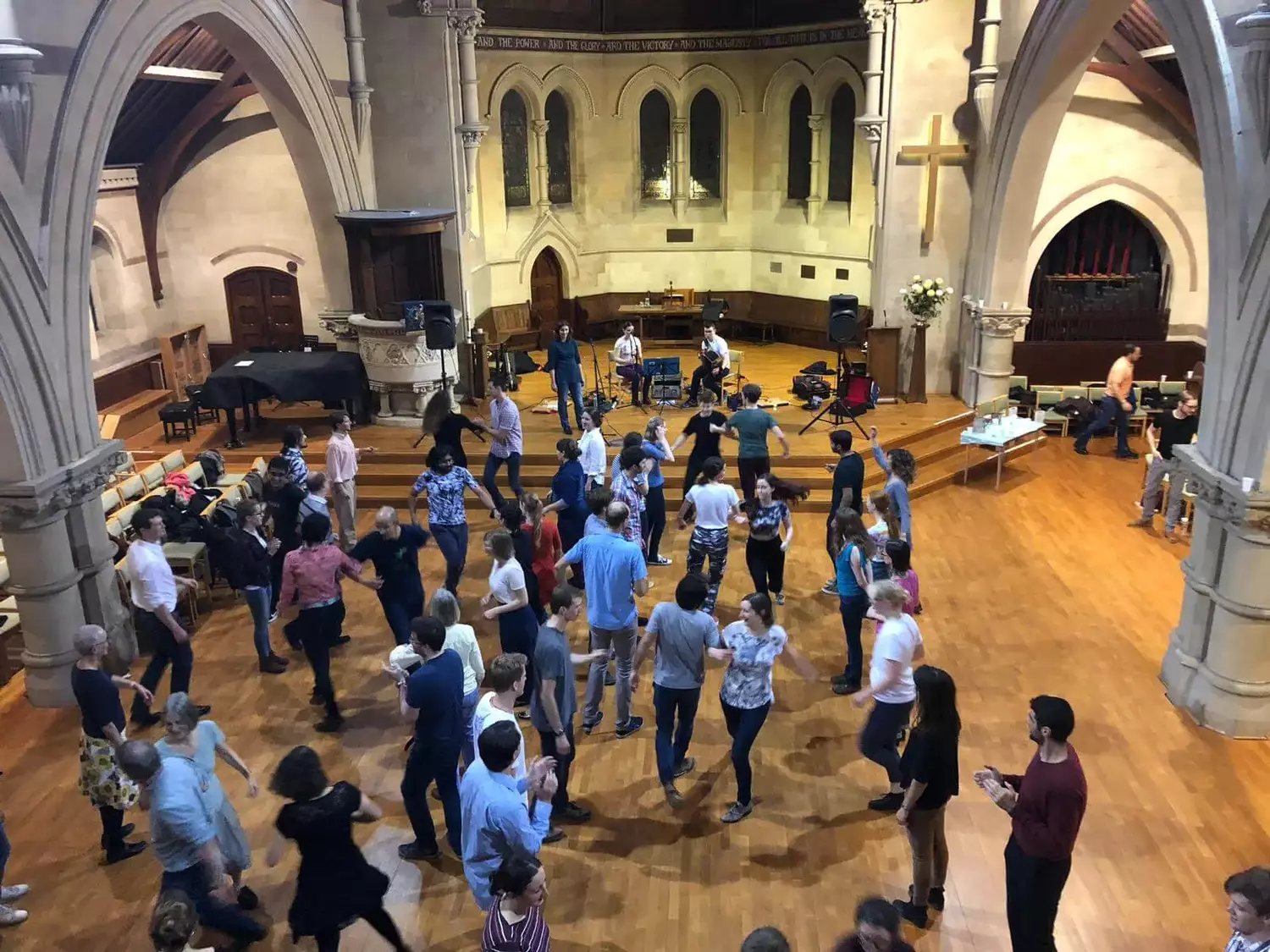People dancing at a ceilidh.